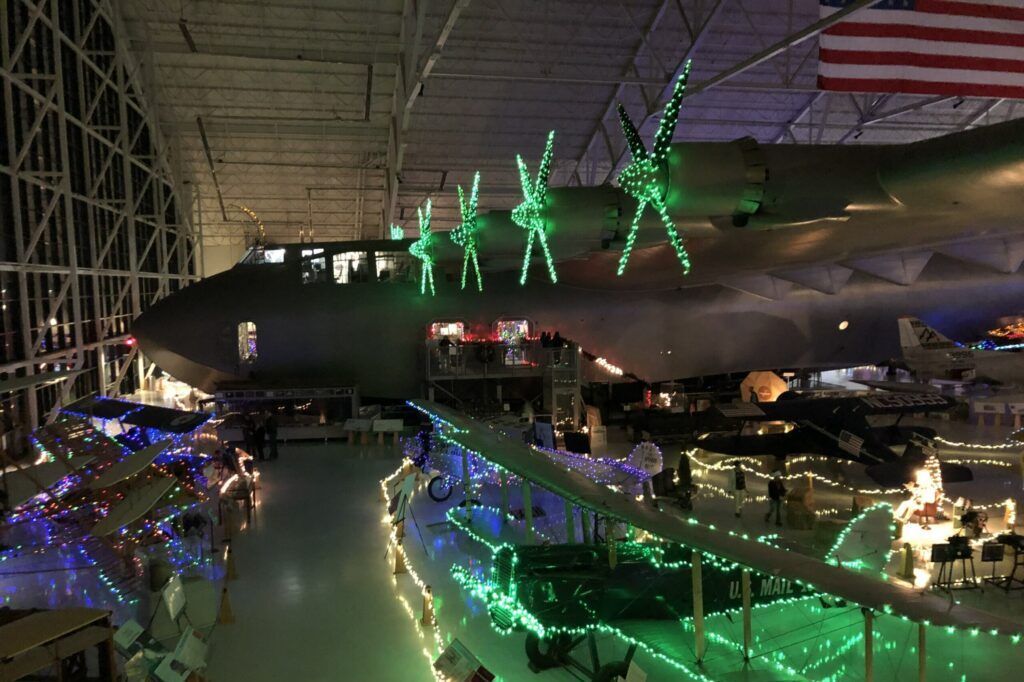 The spruce goose airplane decorated with holiday twinkle lights